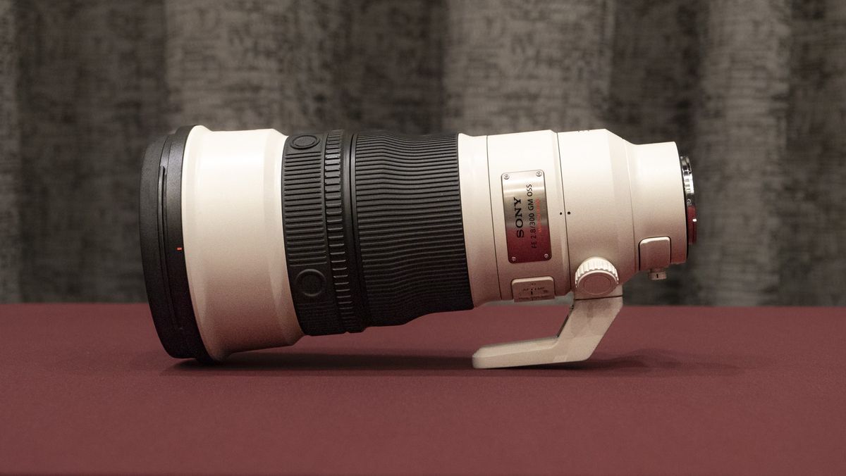 Sony FE 300mm F2.8 GM OSS lens on a red table