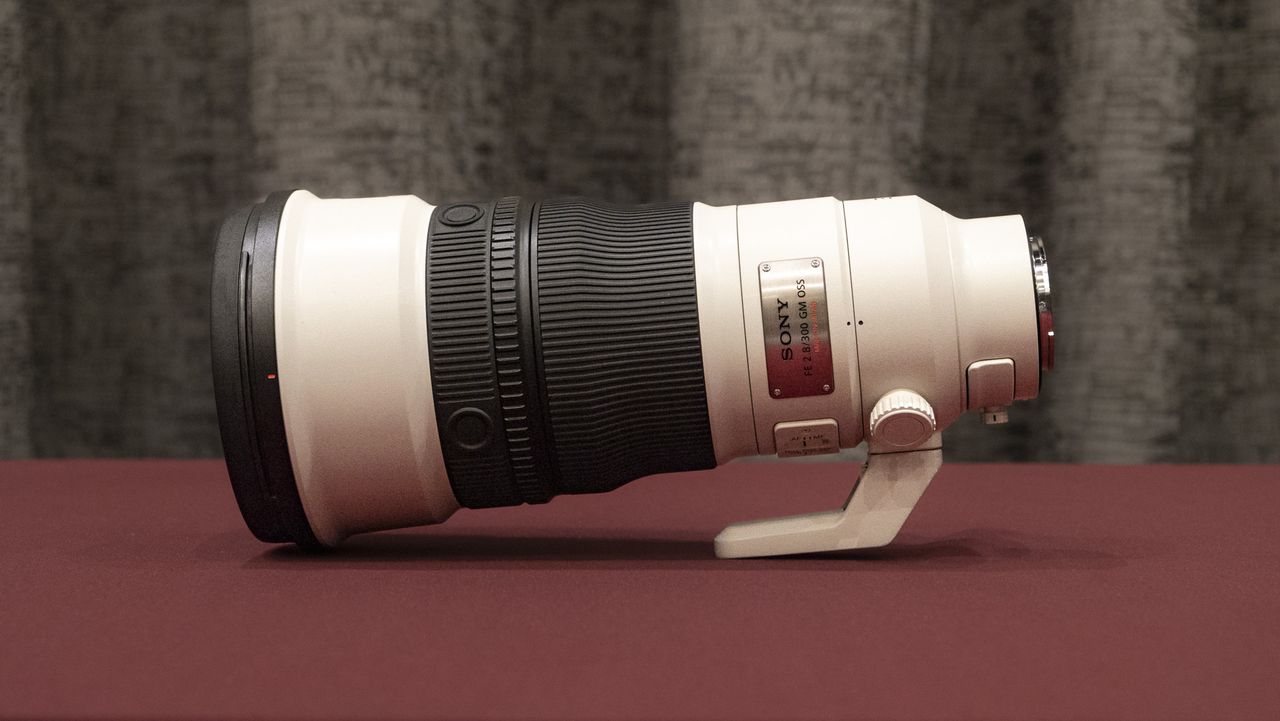 Sony FE 300mm F2.8 GM OSS lens on a red table