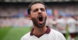 Manchester City star Bernardo Silva celebrates after scoring their sides second goal during the Premier League match between West Ham United and Manchester City at London Stadium on September 16, 2023 in London, England. 