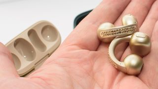 Moto Buds Loop in French Oak in hand showing Swarovski crystals