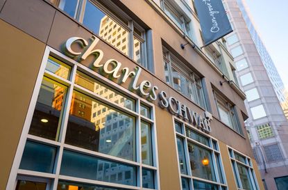 Low-angle view of logo on facade of Charles Schwab brokerage in the Financial District neighborhood of San Francisco, California, December 25, 2018.
