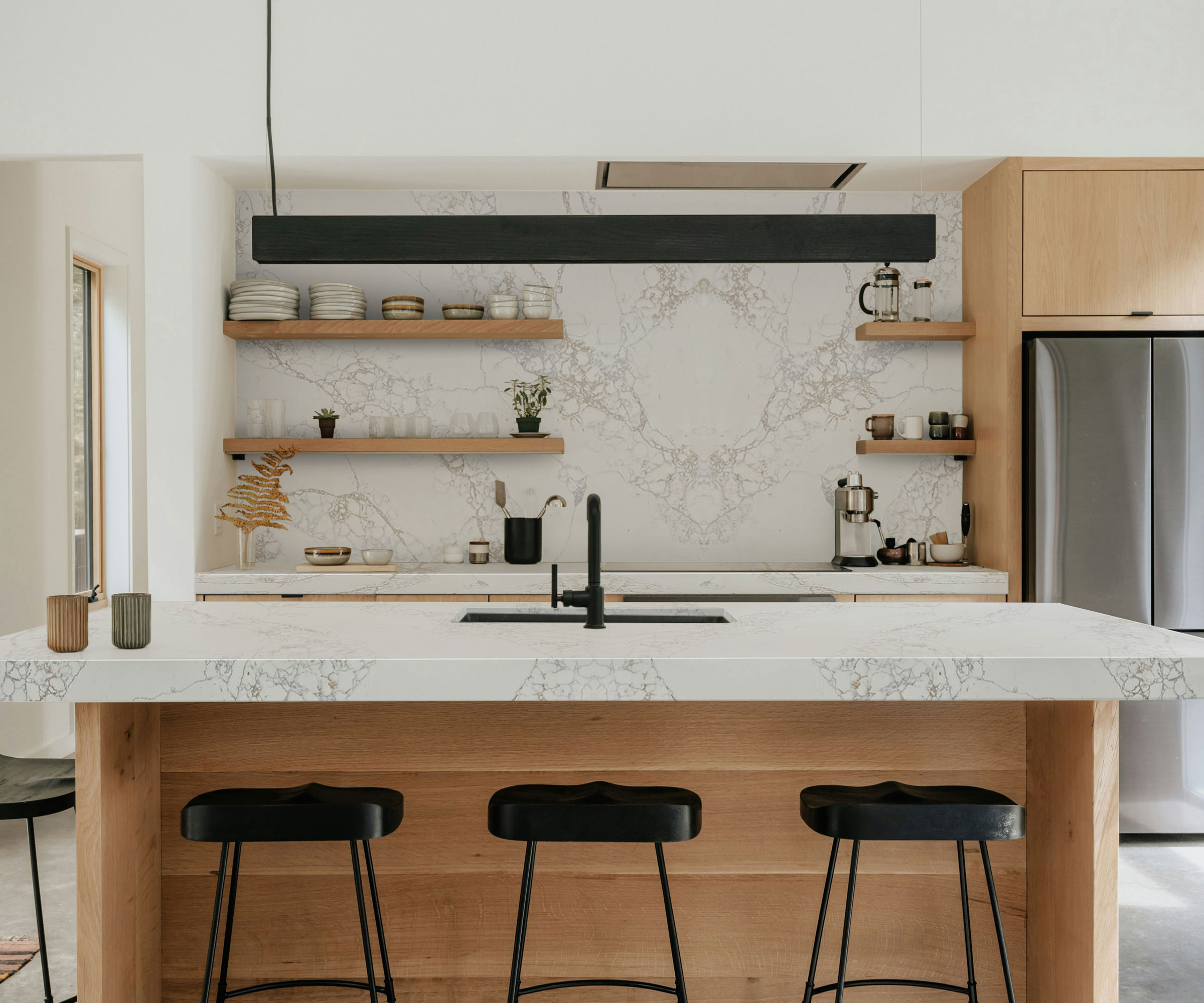 modern wooden kitchen with marble splashback and worktops