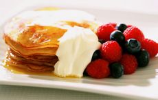 Pineapple and coconut pancakes with golden syrup and crème fraiche