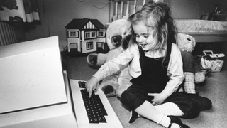 8th May 1980: Four-year-old Antonia Salmon with one of her birthday presents, a computer which used to belong to her father.