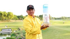 Ashun Wu holds up the Volvo China Open trophy after winning in 2025