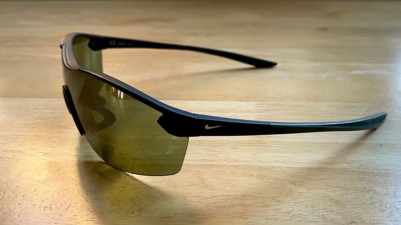 the Nike Victory Elite women's sunglasses laid on a table