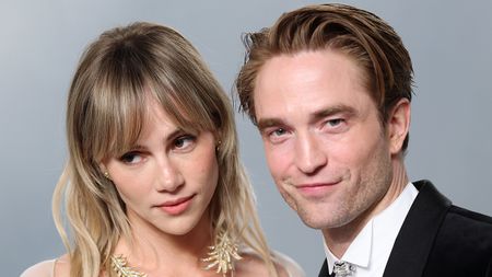 Robert Pattinson and Suki Waterhouse wear white and black respectively on the Oscars red carpet.