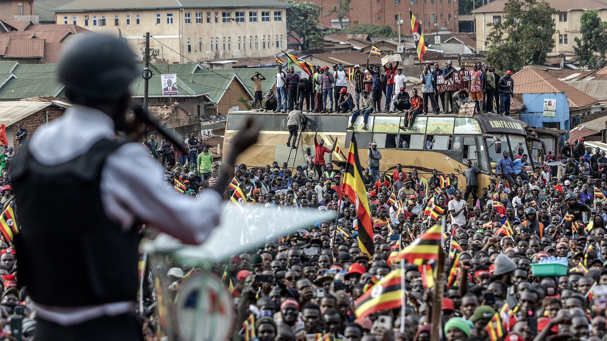 Presidential candidate Robert Kyagulanyi Ssentamu, popularly known as Bobi Wine, talks to supporters during his party's final campaign rally ahead of elections in Kampala, Uganda
