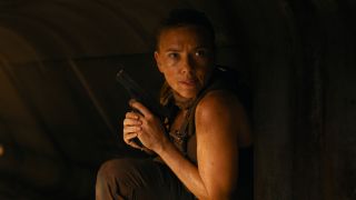 Zora Bennett (Scarlett Johansson) hides for cover in Jurassic World Rebirth