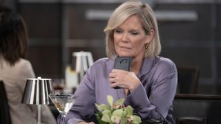 Maura West as Ava holding a phone in General Hospital