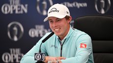 Matt Fitzpatrick of England looks on as they are interviewed prior to The 151st Open at Royal Liverpool Golf Club