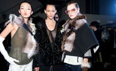 Female models dressed in the Fendi A/W 2014 backstage of the fashion show