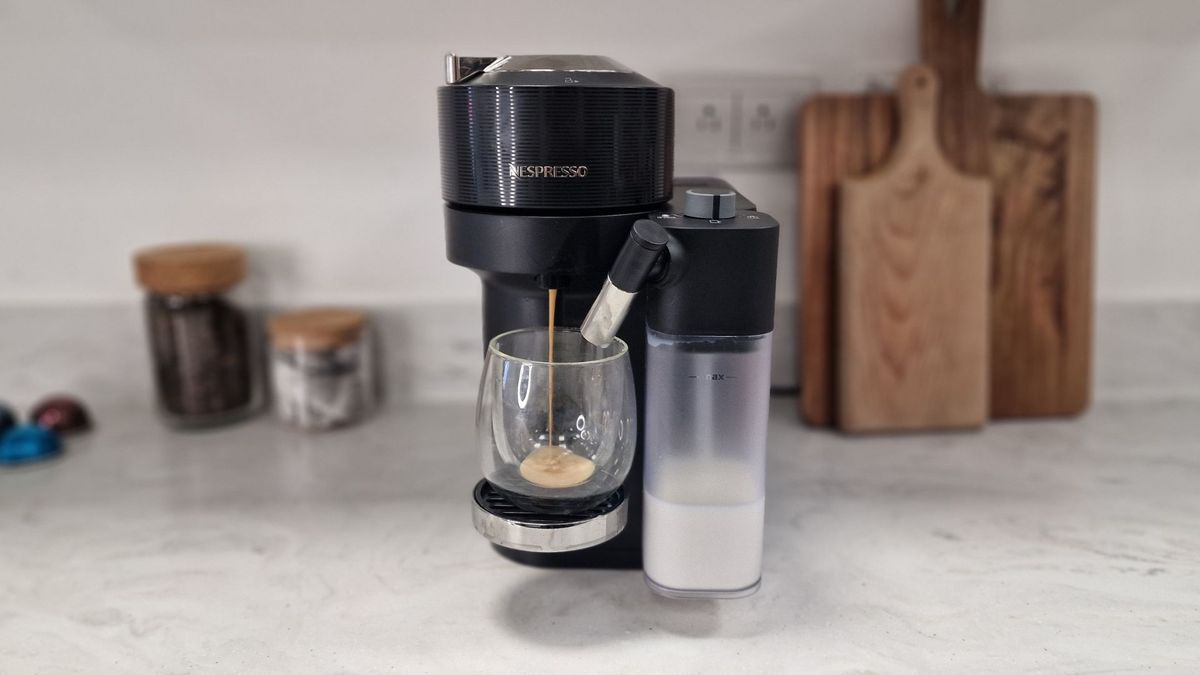 Nespresso latissima vertuo making a cup of coffee with a filled milk frother