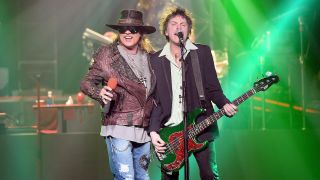 Singer Axl Rose (L) and bassist Tommy Stinson of Guns N' Roses perform at The Joint inside the Hard Rock Hotel & Casino during the opening night of the band's second residency, "Guns N' Roses - An Evening of Destruction. No Trickery!" on May 21, 2014 in Las Vegas, Nevada.