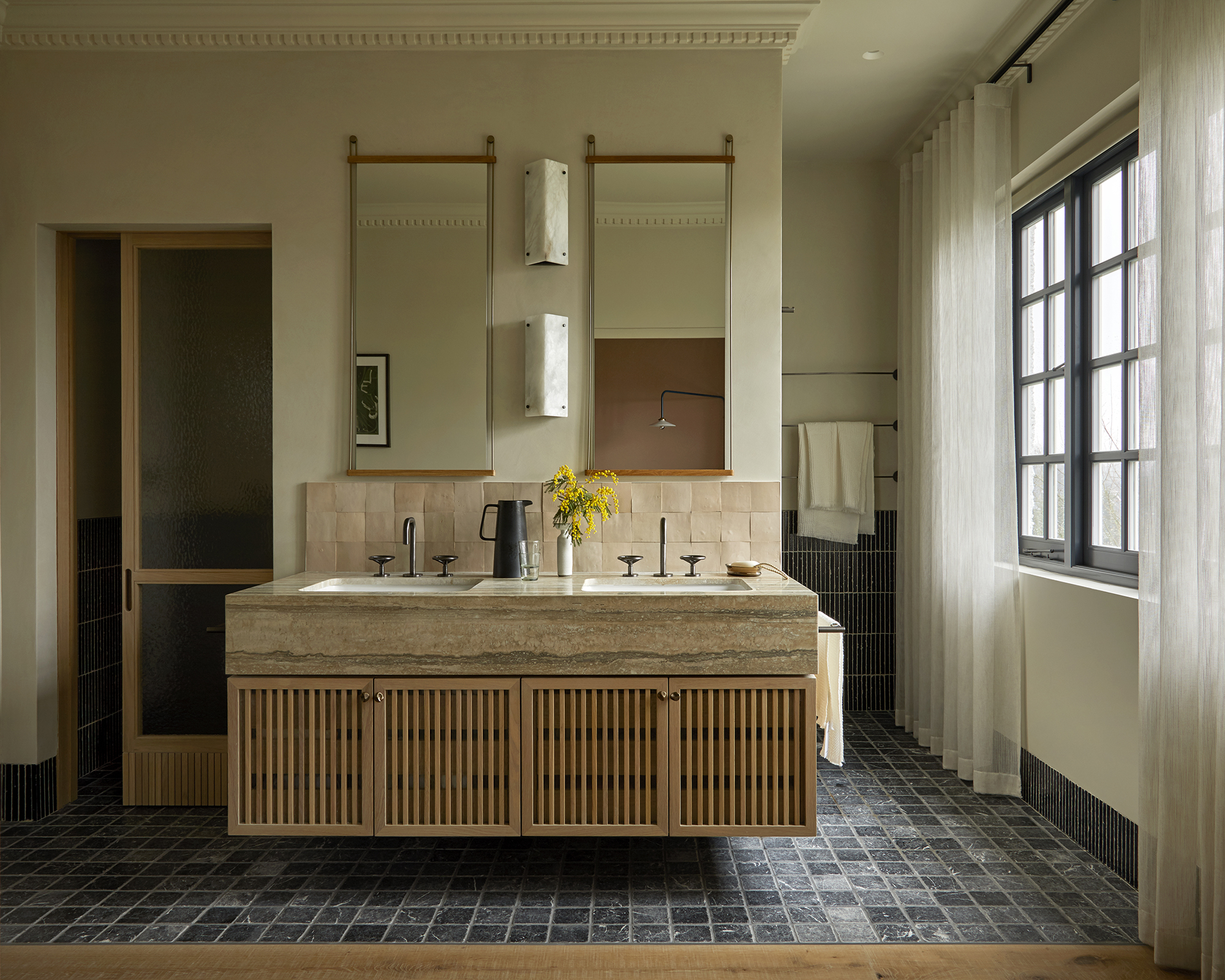 large bathroom with double vanity and two mirrors above it