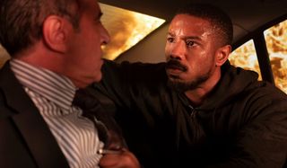 Michael B. Jordan interrogates a man in a burning car in Without Remorse.