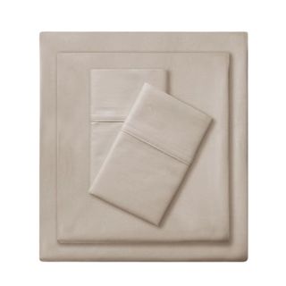 A folded square beige bedding set, with a folded square sheet on top of it and two folded pillow covers on top of that