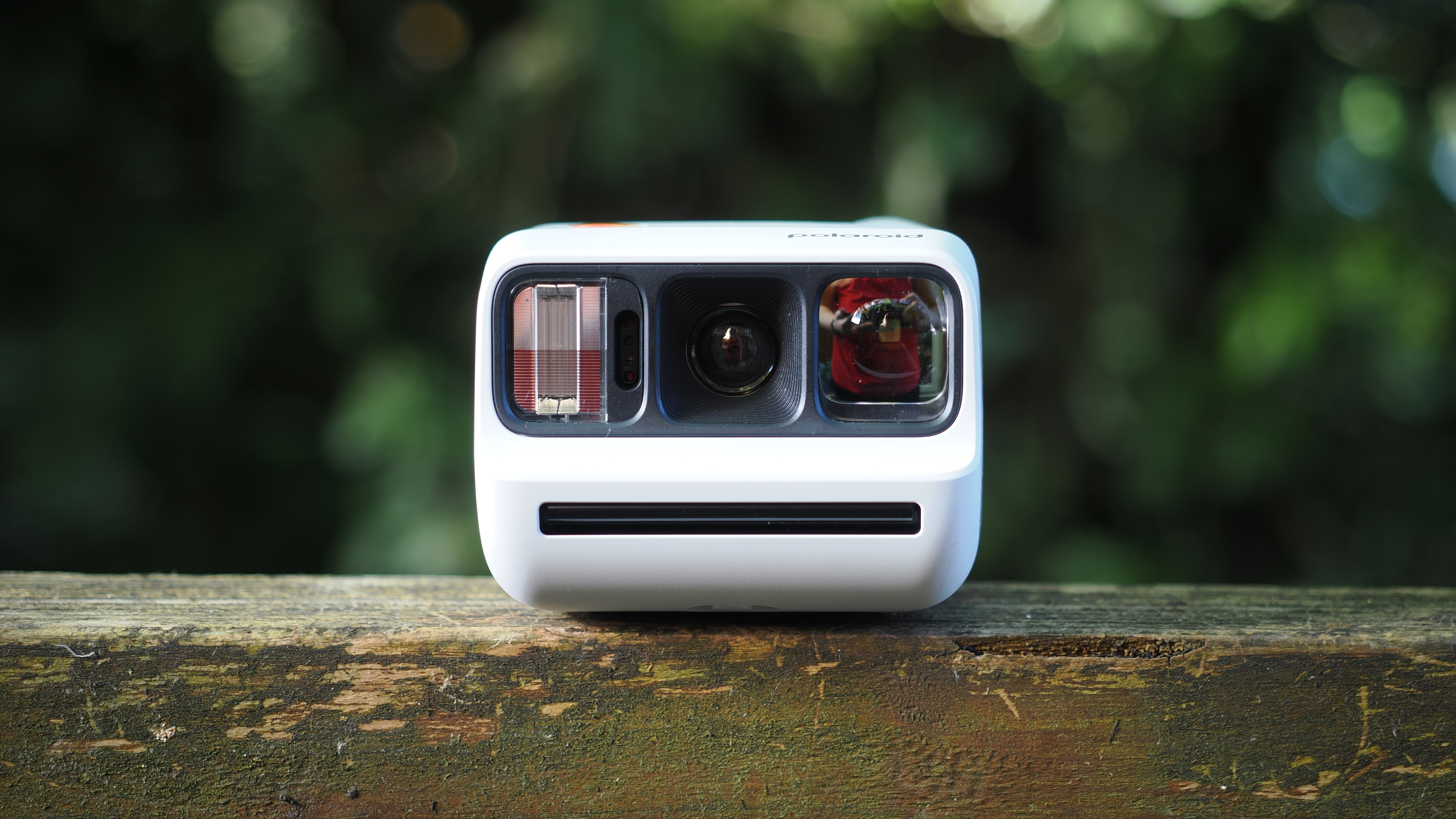 Polaroid Go Gen 3 on a wooden surface outdoors