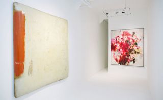 Left: canvas painted cream, with a red stripe down the left hand side. Right: cream background with splashes of red and black