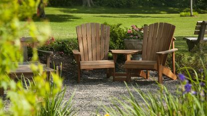 Wooden chairs in a backyard in Maine