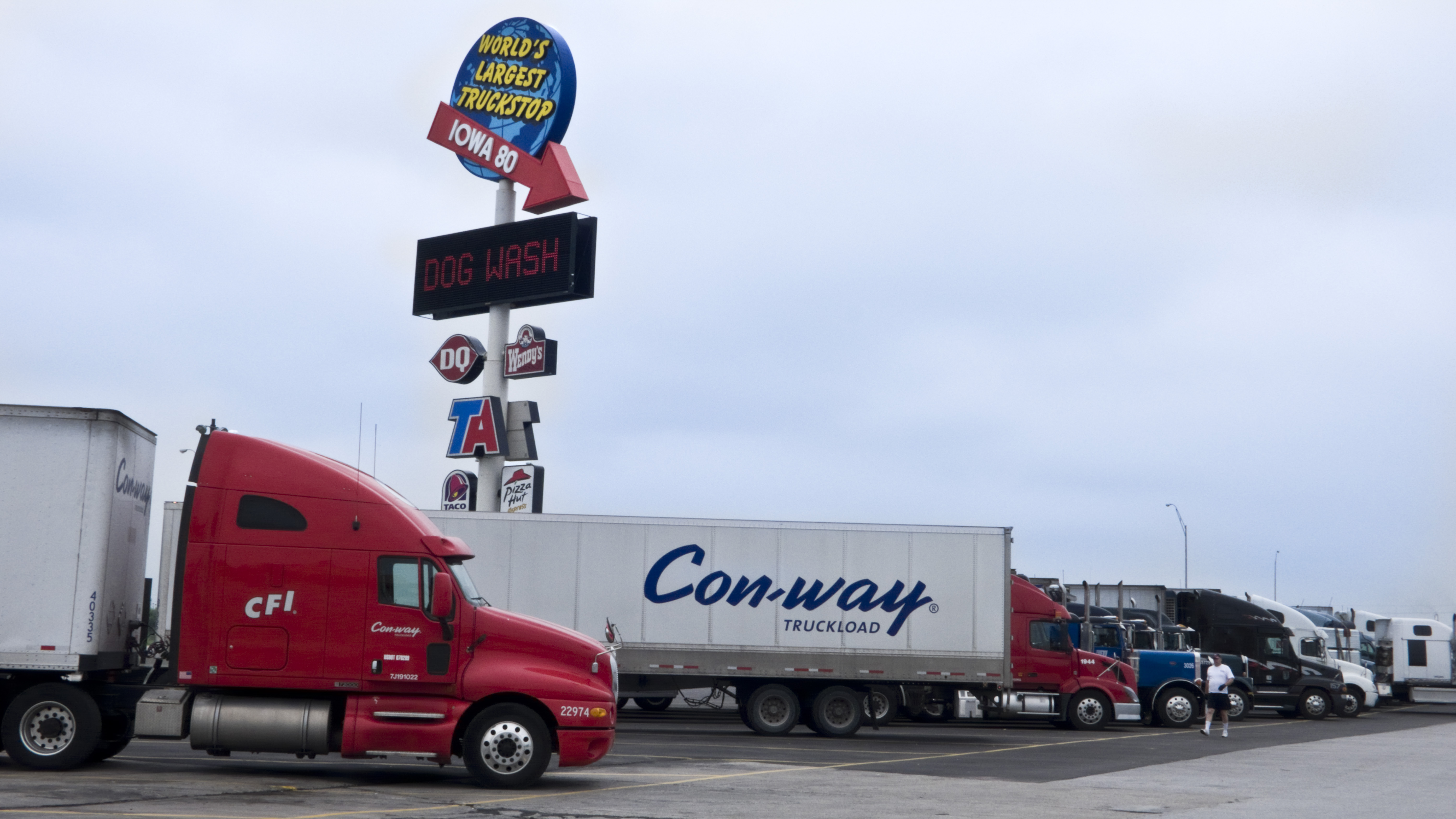 Big-rig trucks in front of the Iowa 80 sign