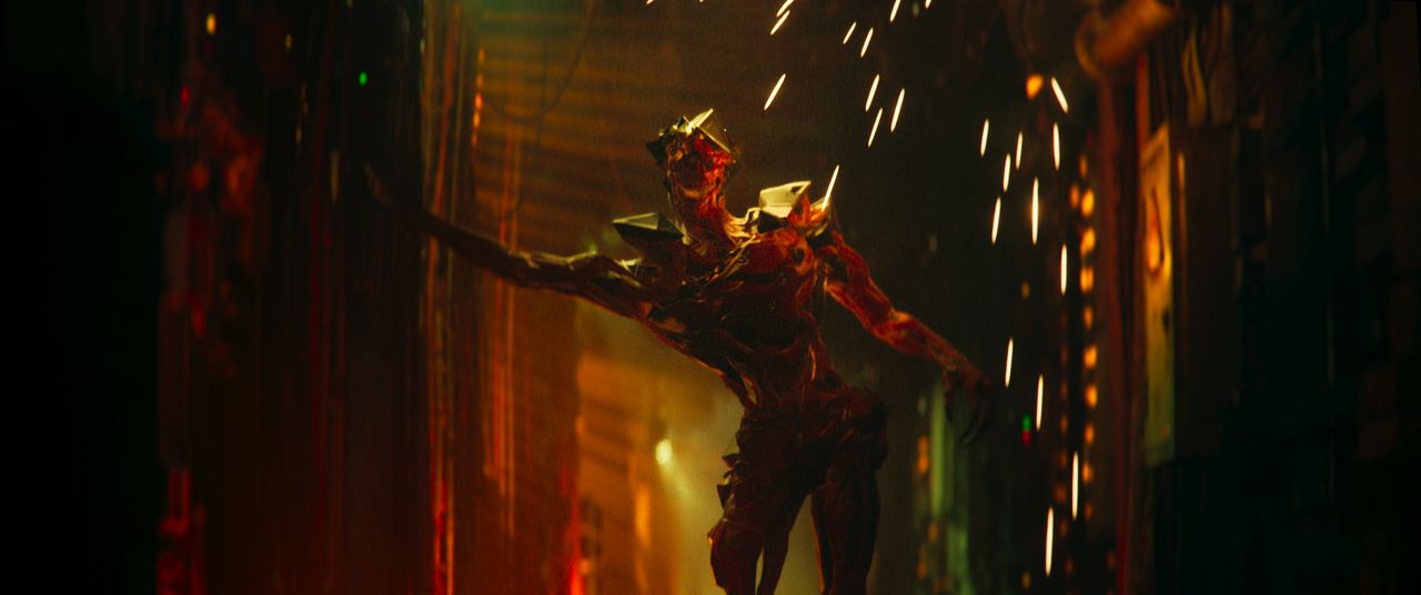 Babiru DaVinci Resolve colour tips; a part human part android figure stumbles down a corridor as sparks drop from the roof