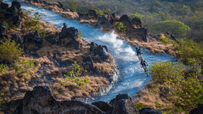 Mountain bikers race down a trail at Rio Perdido in Costa Rica