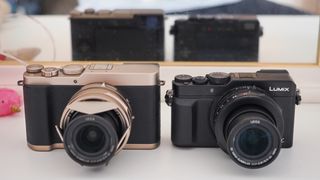 Panasonic Lumix L10 next to a Panasonic Lumix LX100