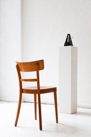 Wooden chair with white wall