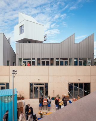 A view of East Quay's courtyard, first floor gallery and an accommodation pod.