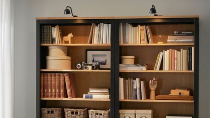 IKEA Billy bookcase lighting over the top, with shelves styled with books and decor