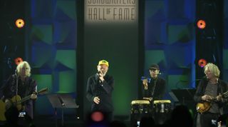 (from left) Mike Mills, Michael Stipe, Bill Berry and Peter Buck of R.E.M. perform onstage during the 2024 Songwriters Hall of Fame Induction and Awards Gala at the New York Marriott Marquis Hotel in New York City on June 13, 2024