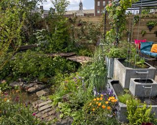 Rainwater harvesting and flood water swale in Flood Re: The Flood Resilient Garden at Chelsea Flower Show 2024