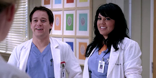 Grey's Anatomy George and Callie smile awkwardly in the hospital.