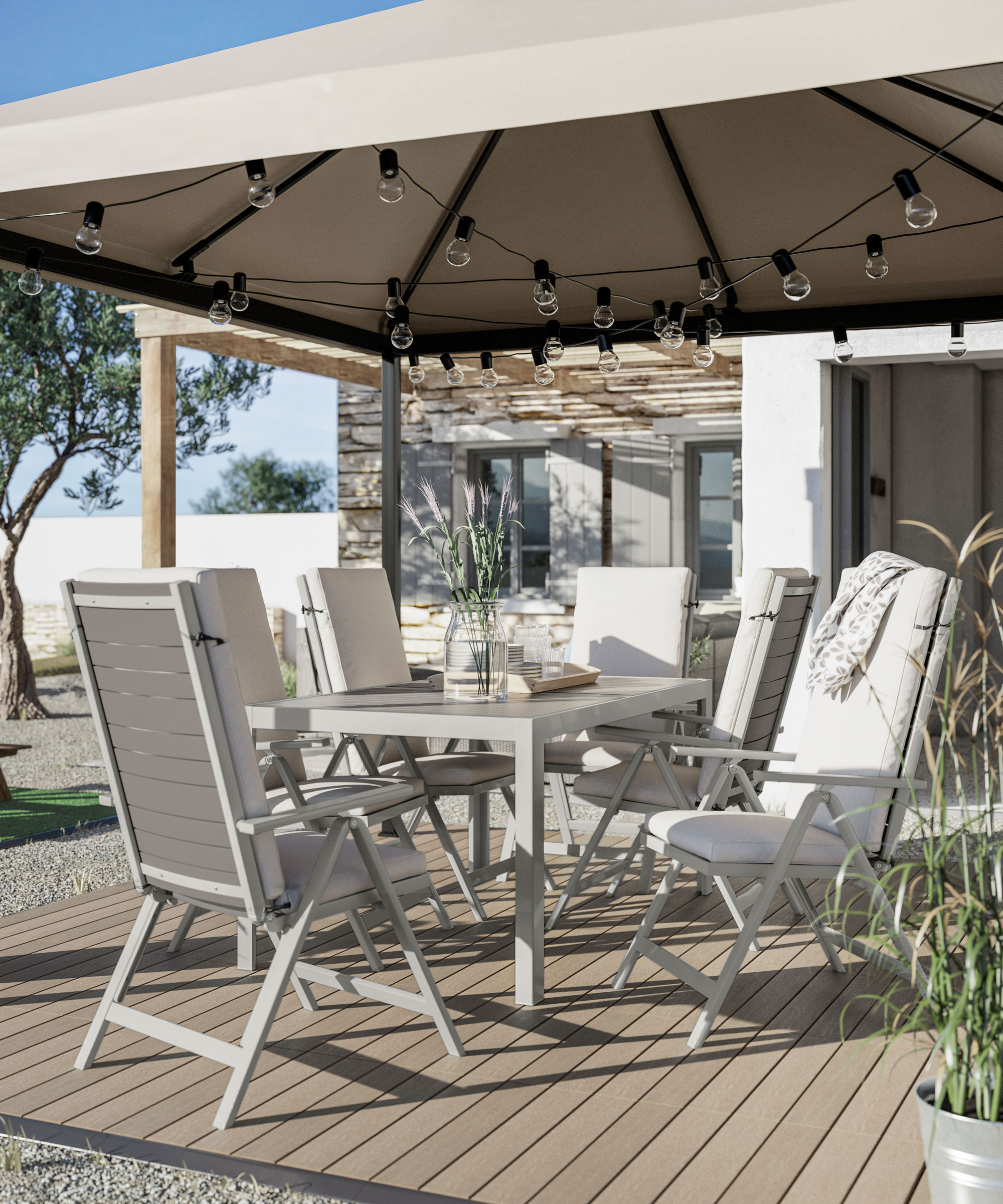 gazebo on deck draped with festoon lights, with garden furniture and accessories