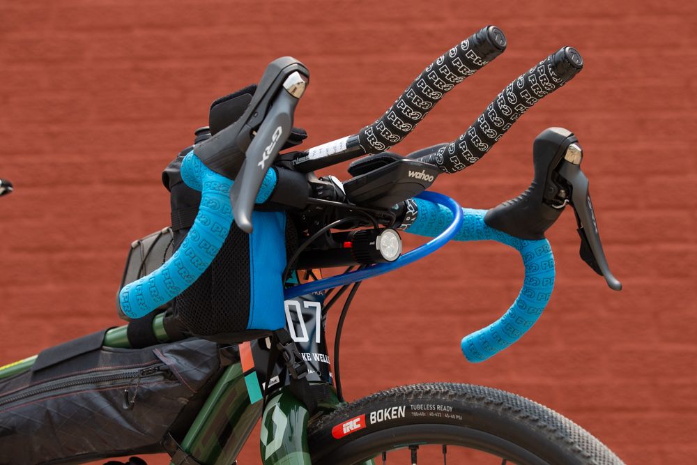 A look at the busy front end of Jake Wells' bike reveals a Wahoo Roam GPS cycling computer to keep track of the rural navigation