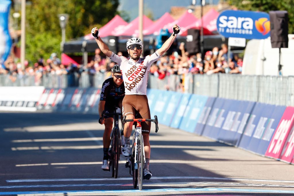 Team AG2R rider Italys Andrea Vendrame celebrates as he crosses ahead of Team DSM rider Australias Chris Hamilton the finish line to win the twelfth stage of the Giro dItalia 2021 cycling race 212 km between Siena and Bagno di Romagna on May 20 2021 Photo by Luca Bettini AFP Photo by LUCA BETTINIAFP via Getty Images