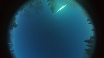 A green fireball streaks across the sky over Alberta, Canada