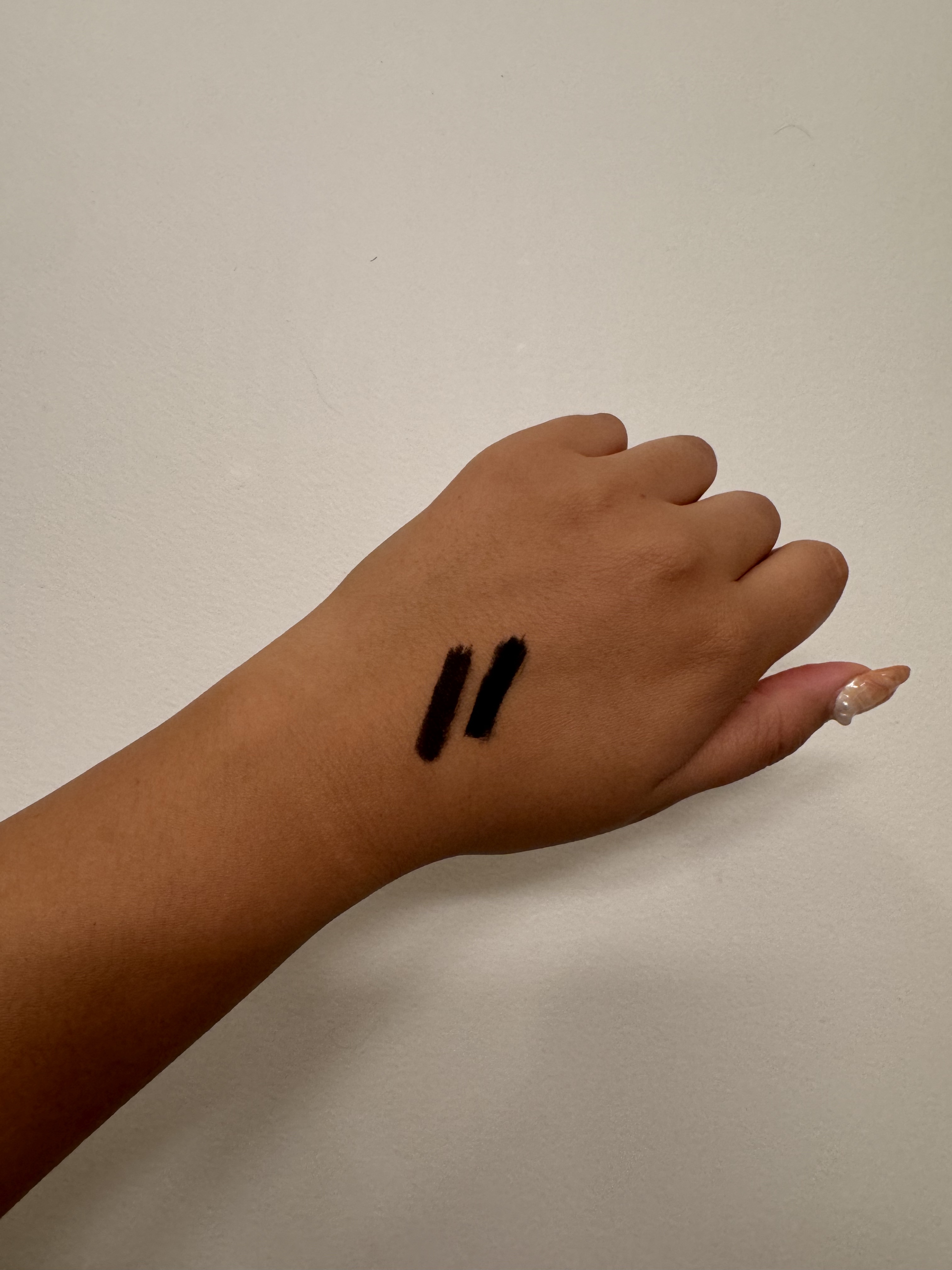 Hourglass Voyeur Waterproof Gel Eyeliner black and brown swatches on back of hand