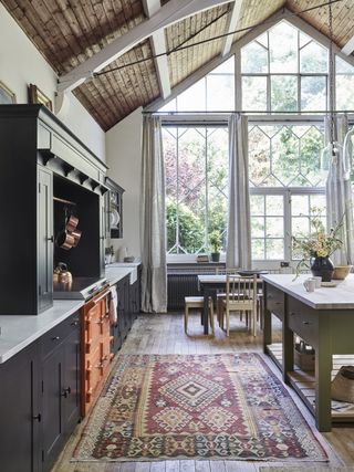 Black and green kitchen designed by Neptune