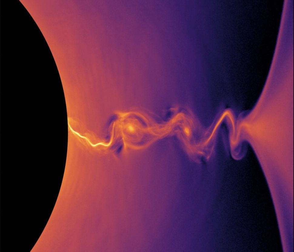 A visualization from a supercomputer simulation shows how positrons behave near the event horizon of a rotating black hole.