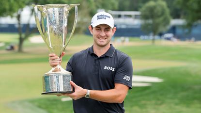 Patrick Cantlay of the United States poses with The Western Golf Association Trophy after putting in to win on the 18th green during the final round of the BMW Championship at Wilmington Country Club. BMW Championship Live Stream