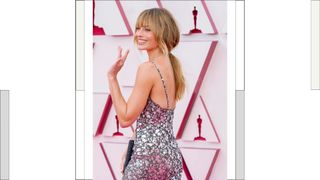 Margot Robbie wears a silver strappy dress as she attends the 93rd Annual Academy Awards at Union Station on April 25, 2021 in Los Angeles, California.