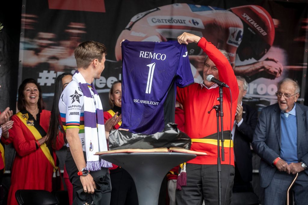 Belgian Remco Evenepoel receive RSC Anderlecht jersey with number one from Dilbeek council member and Rscas lawyer Luc Deleu during the celebration of world champion Evenepoel in Dilbeek and start of a big bike ride to Brussels Sunday 02 October 2022 22 years old Evenepoel from Schepdael Dilbeek became world champion after a great season with a win at the Vuelta first Belgian in 44 years to win a big tour BELGA PHOTO HATIM KAGHAT Photo by HATIM KAGHAT BELGA MAG Belga via AFP Photo by HATIM KAGHATBELGA MAGAFP via Getty Images