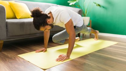 Man completes a HIIT workout at home