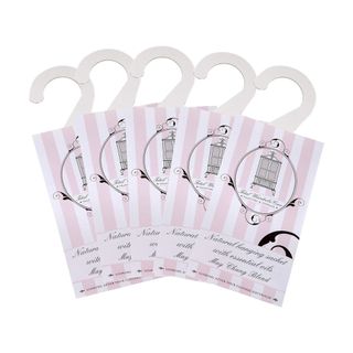 5 pink and white striped paper sachets with handles on the top