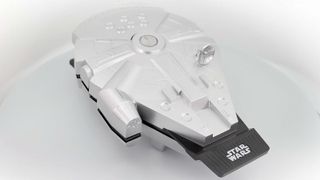 A product shot of a waffle maker shaped like the Millennium Falcon from Star Wars