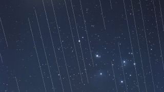 This image of the Pleiades shows the tracks of Starlink satellites. The reflective surfaces of the satellites, coupled with the fact that they are orbiting around Earth, mean that astronomical observations that require very long exposures capture “tracks” of the satellites in their images.