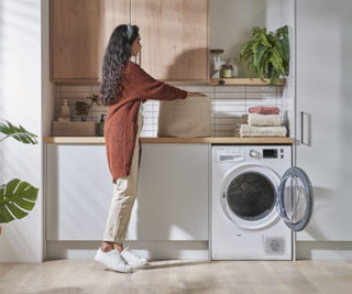 Hotpoint ActiveCare Tumble Dryer in a relaxing green kitchen