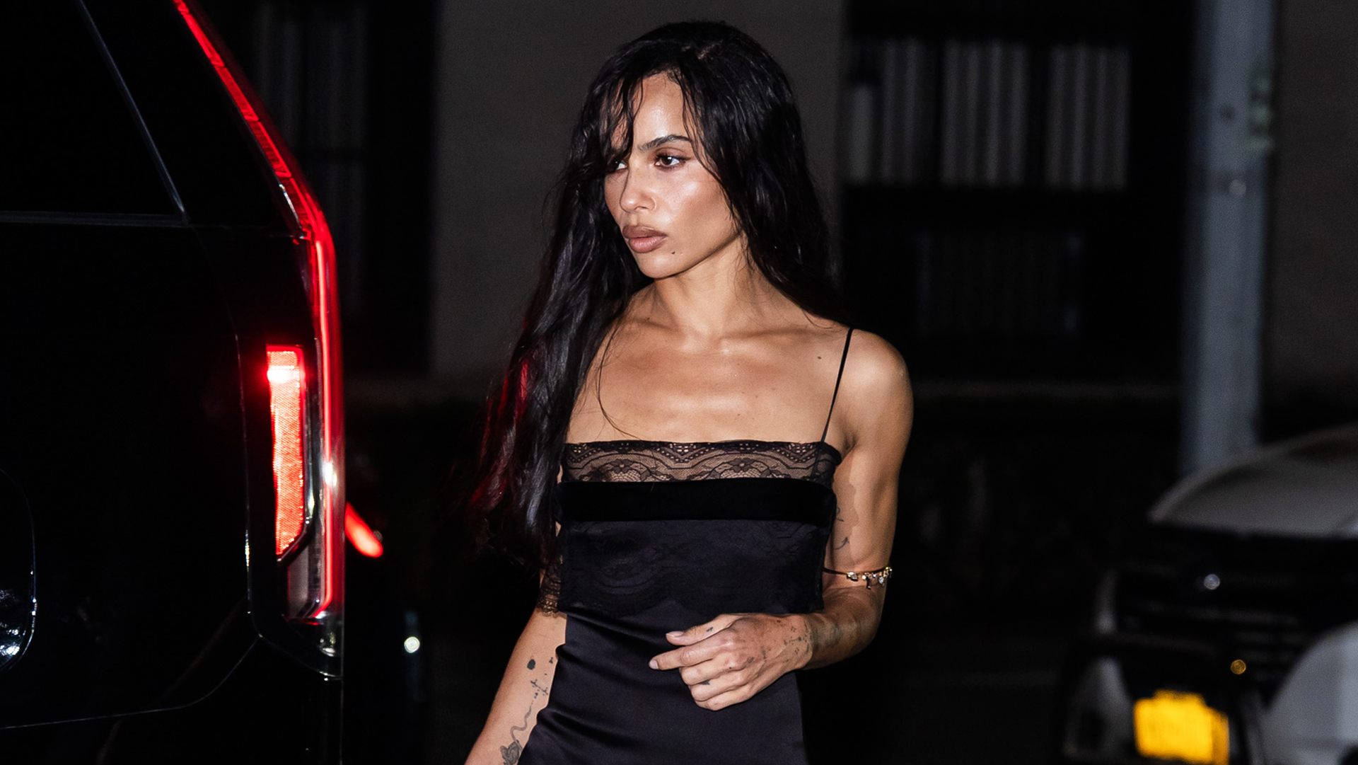 Zoe Kravitz wearing a black lace-trim slip dress
